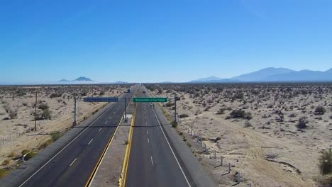 view of a drone ascending over a highway