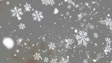 digital animation of multiple snowflakes icons falling against grey background