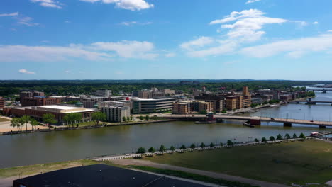 aerial view toward the cityscape and bridges on the fox river, in sunny greenbay, usa