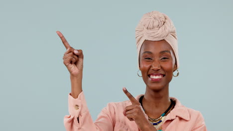 African-woman,-portrait-and-pointing-in-studio