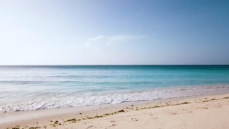 Perfect-slow-motion-aerial-flight-of-a-paradise-dream-beach-wave-and-crystal-clear-turquoise-water