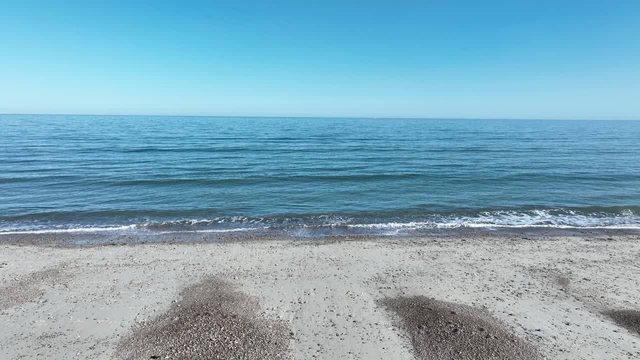 Static shot of Sandy Neck Beach the barrier beach in the Massachusetts that stretches 6.5 miles long and one and a half miles wide along Cape Cod Bay, Barnstable, USA. Undulating dunes.