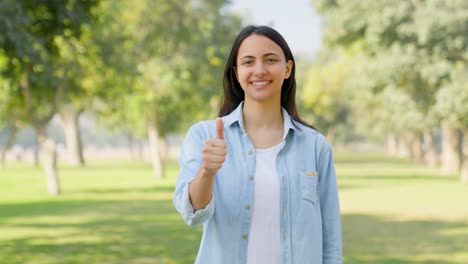 happy indian girl showing thumbs up