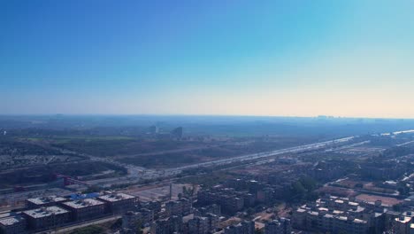 Aerial-view-of-Islamabad,-Kashmir-highway-with-busy-traffic-roads-and-bridges