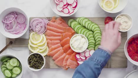 assembling bagel brunch board