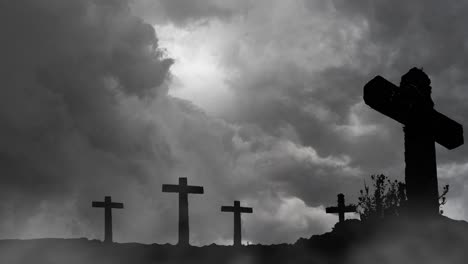 4k silhouette, several christian crosses on rocky hill thunderstorm background