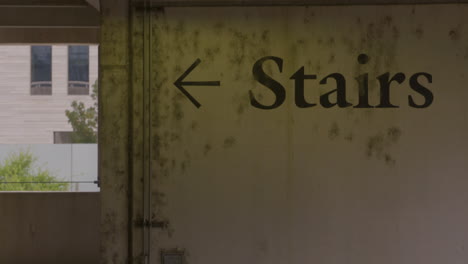 wall labeled "stairs" in parking garage