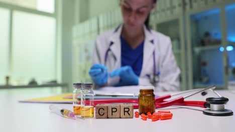 medical professional with cpr blocks and supplies