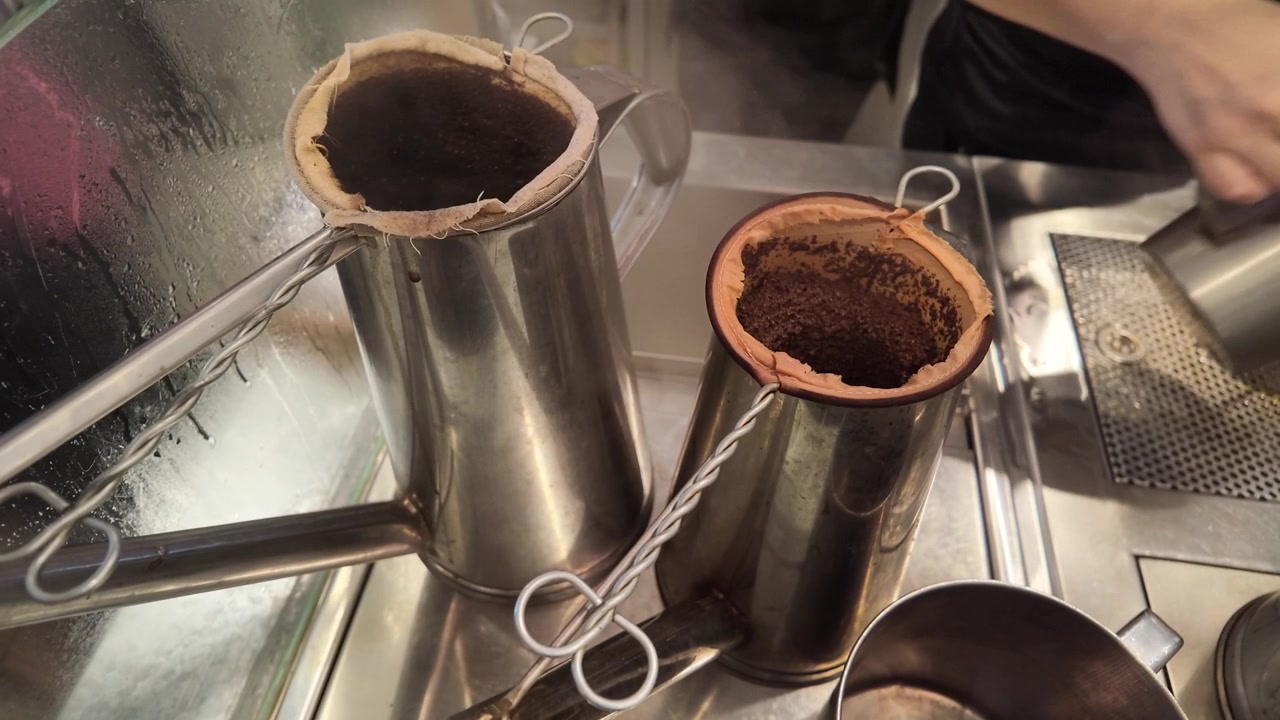 Traditional Coffee Brewing with Cloth Filters in Stainless Steel Pots