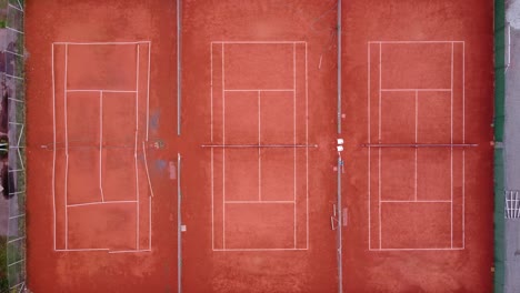 empty tennis courts in a park