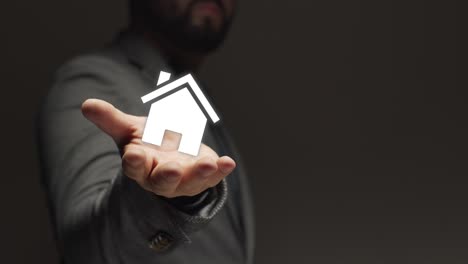 house in hand palm of business person. background for real estate property industry. new life. new home