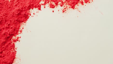 video of red coloured powders with copy space on white background