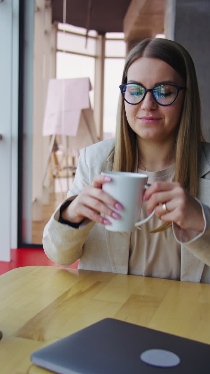 Businesswoman indoor laptop working. Business lady working in modern office with laptop. Vertical video