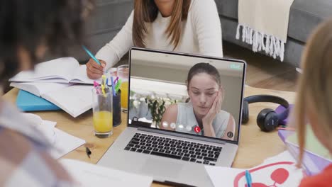 Diverse-students-having-class-during-laptop-video-call-in-slow-motion