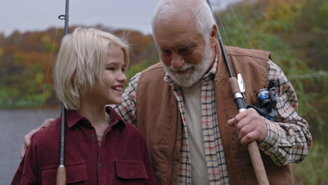 grandfather and grandson fishing together in autumn