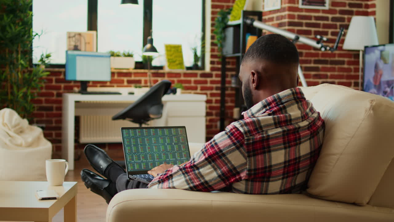 Man Analyzing Stock Market at Home