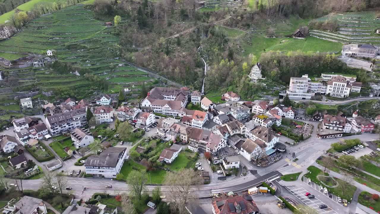 Aerial view of the quaint village of Wessen nestled amidst the Swiss Alps, offering a charming glimpse of Swiss countryside life.