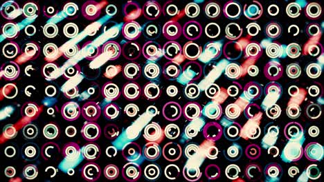 fondo futurista abstracto con pequeños círculos en movimiento y pequeñas partículas moviéndose detrás de ellos en el fondo. animación. muchos anillos en movimiento en fondo negro, bucle sin costuras