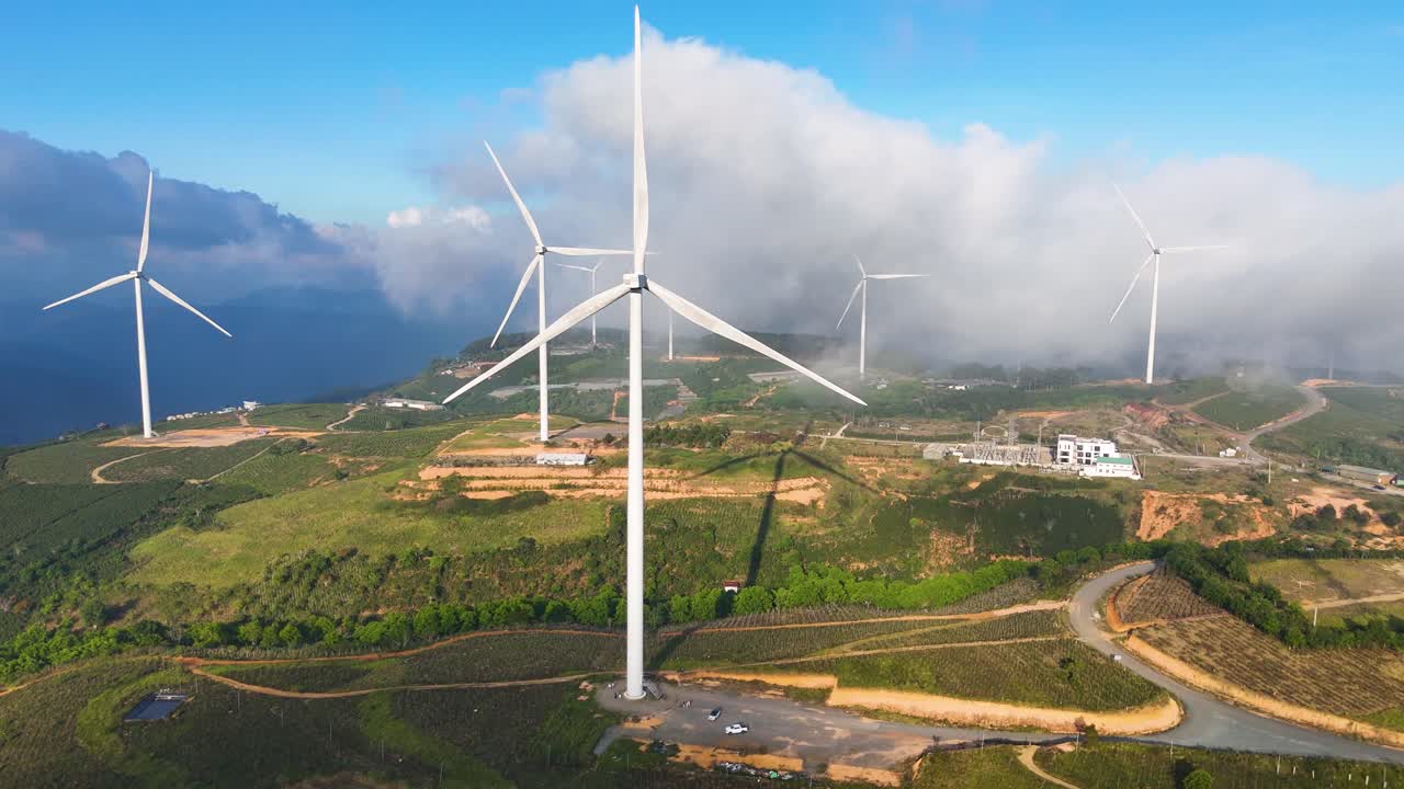 Wind power turbines on high hills in Vietnam at sunrise - Wind power