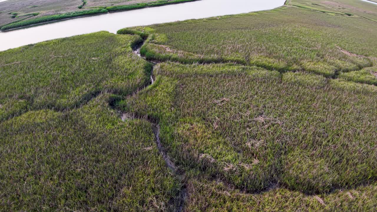 Drone view over winding tidal creeks and vast salt marshland along the South Carolina coast