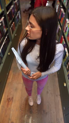 girl browsing books in a library