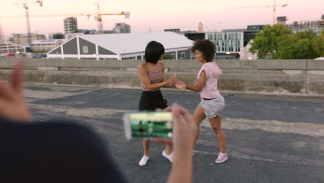 Filming-dance-tutorial-on-phone-of-funky-street