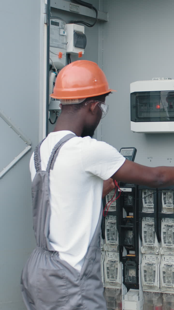 Electrician inspecting electrical panel