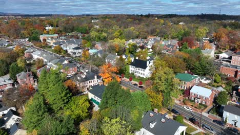 Historical-houses-lining-town-street-with-autumn-trees