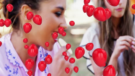 holding red balloon animation, woman eating snack outdoors in park setting