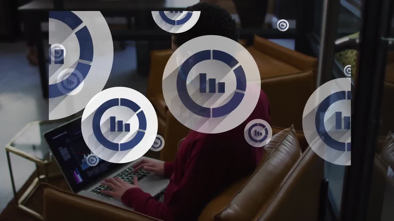 animación de iconos de diagramas sobre una mujer de negocios afroamericana que usa una computadora portátil con máscara facial