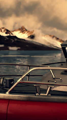 boat in the water with mountains in the background