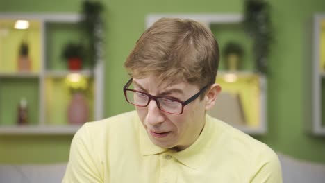 close-up of fresh and scared young man looking at camera.