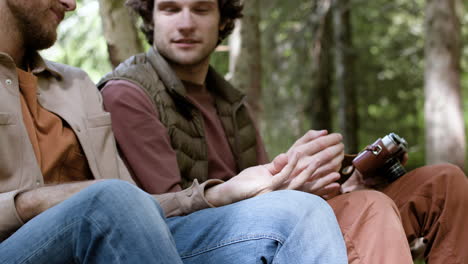 Gay-couple-holding-hands-in-nature