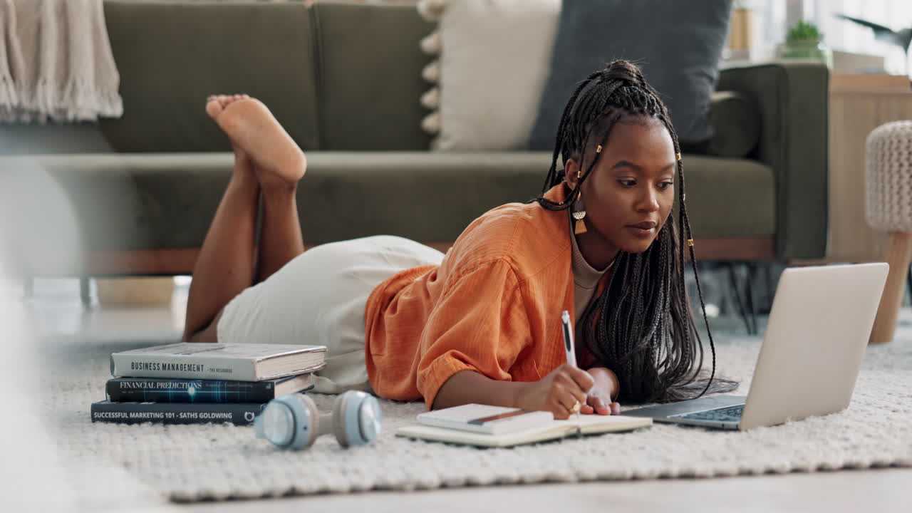 Laptop, laying and woman writing notes