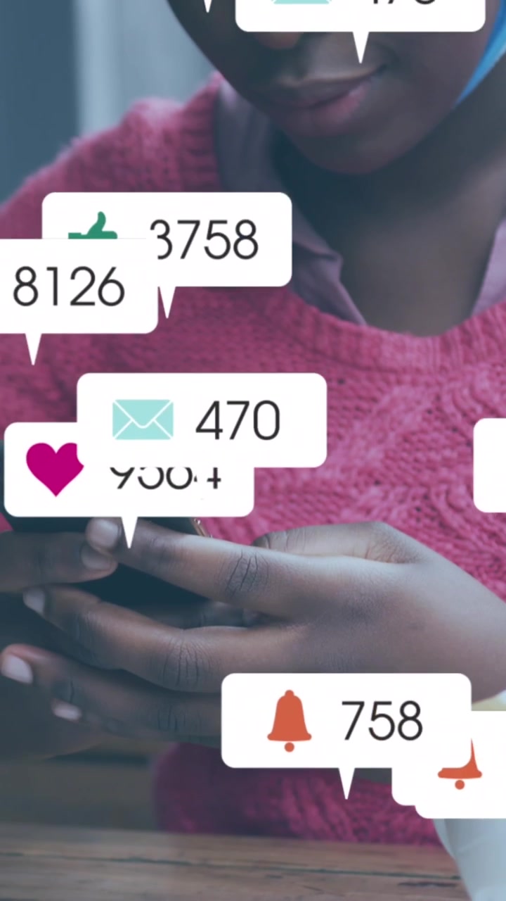 Animation of social media icons over african american woman with face mask using smartphone