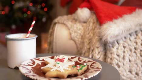 santa hat and gingerbread with milk in living room