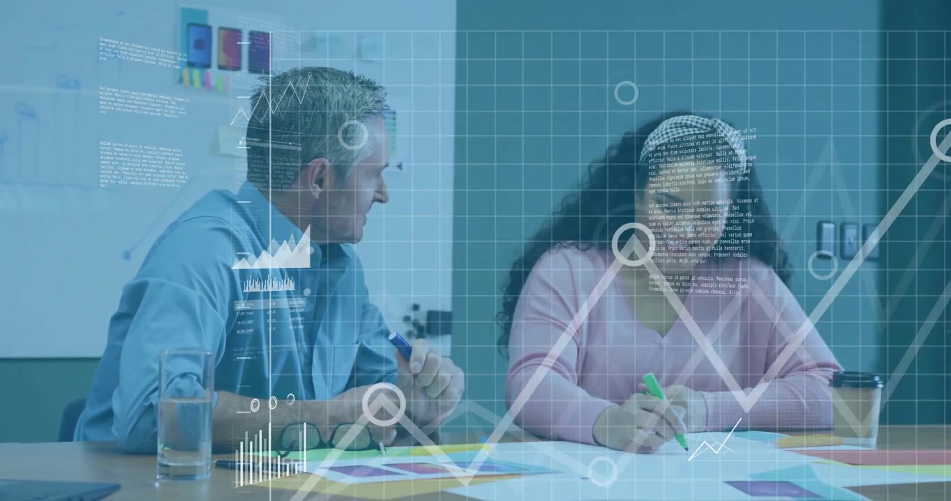 Two colleagues raising markers and sparking notes with holographic data charts in business meeting