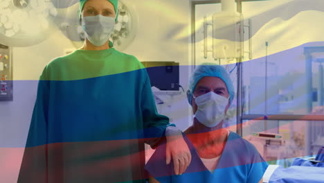 animación de la bandera de colombia sobre diversos cirujanos en la sala de operaciones