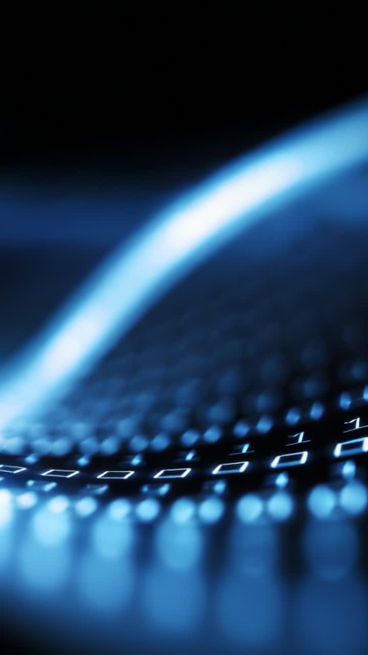 Illuminated keyboard with blue lighting creating an abstract digital atmosphere, highlighting technology's sleek, modern aesthetics in a dark environment