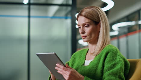 thoughtful manager working tablet office closeup. focused woman using computer