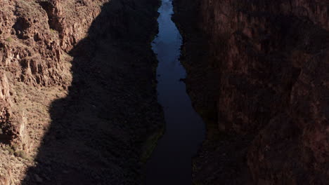 panning up to reveal rio grande river in deep canyon