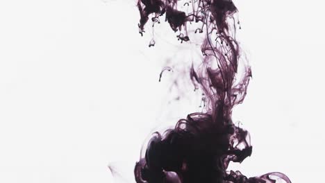 slow motion video of purple watercolor ink mixing in water against grey background