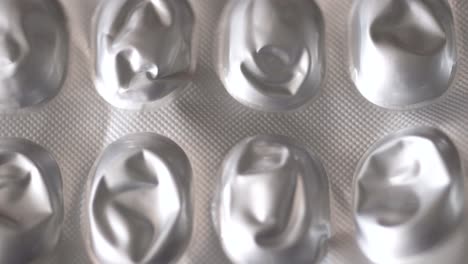 empty medical pills containers on white background, medical themed texture