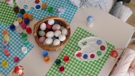 table full of handmade easter eggs