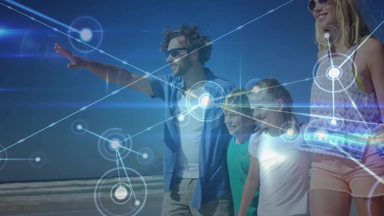 Vertical video: Family walking beach, dad pointing, sparking nodes, lines and glows showing tech