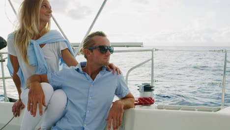 happy couple sailing on yacht