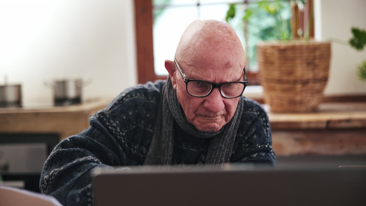 Senior, man and writing or reading with laptop