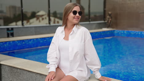 woman relaxing by the rooftop pool