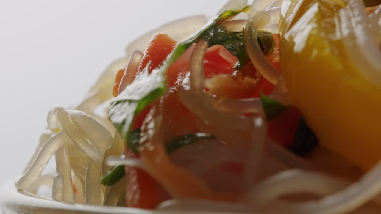 Glass noodles salad with meat and carrots fermented close up asian chinese traditional food.