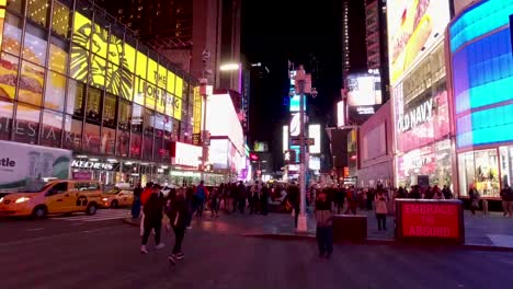 a timelapse of people walking over a pedestrian crossing on the times square in new york city
